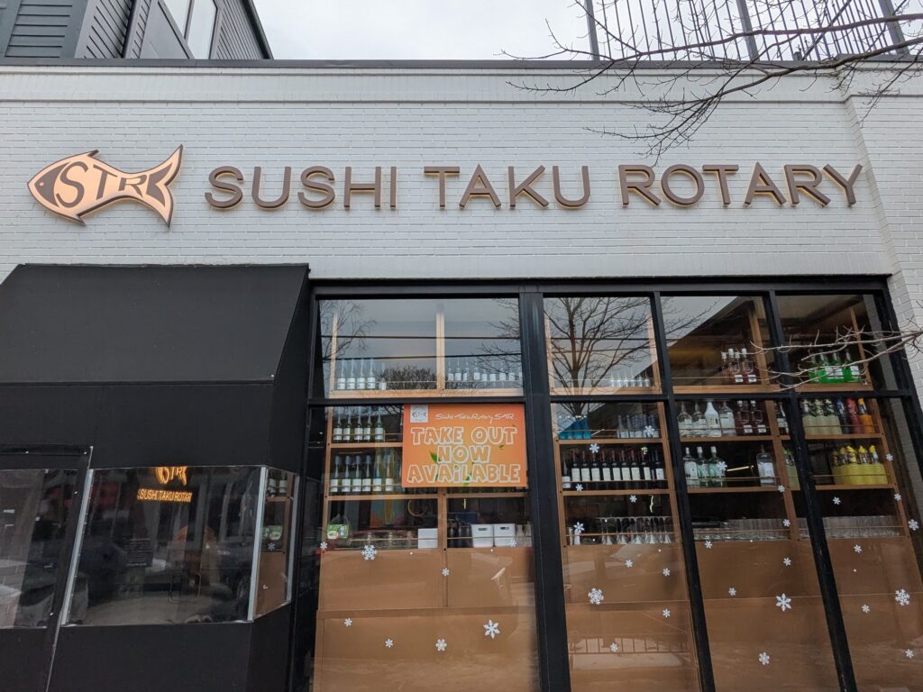 An picture of the restaurant front for Sushi Taku Rotary (STR), located in Lincoln Park Chicago.